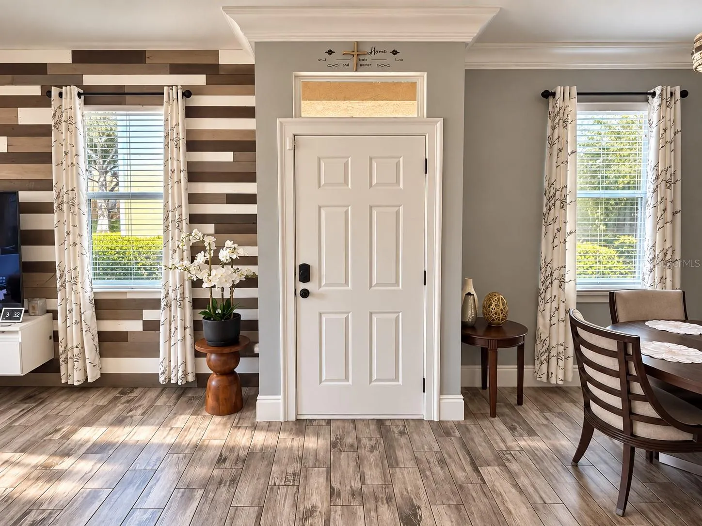 Welcoming entryway with stylish wood-look flooring.