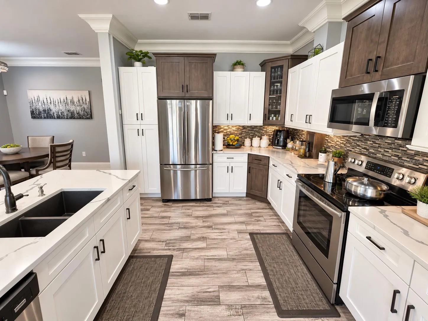 Kitchen with stainless steel appliances and generous counter space.