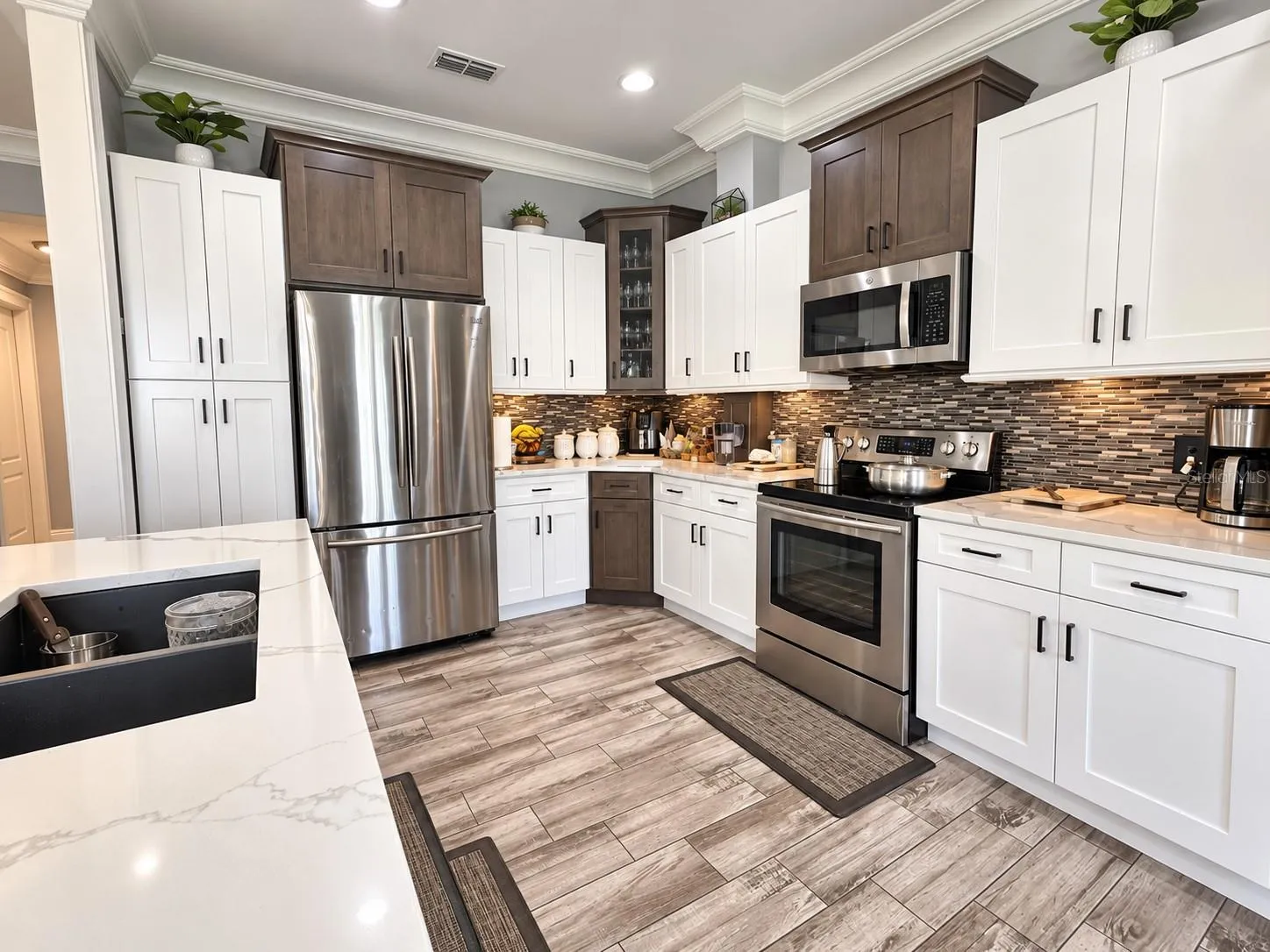 Beautiful kitchen featuring two-tone cabinetry