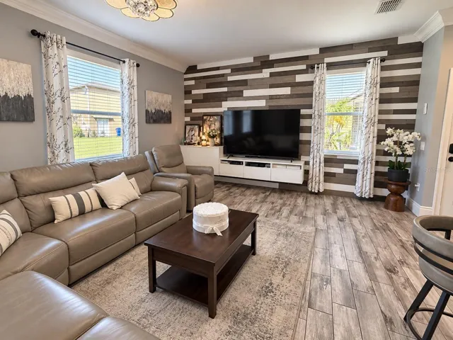 Spacious living room with decorative accent wall