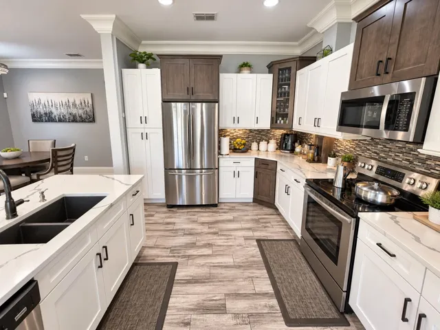 Kitchen with stainless steel appliances and generous counter space.