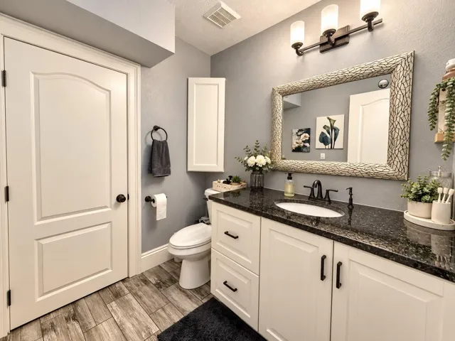 Bathroom with vanity and storage.