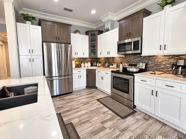 Beautiful kitchen featuring two-tone cabinetry