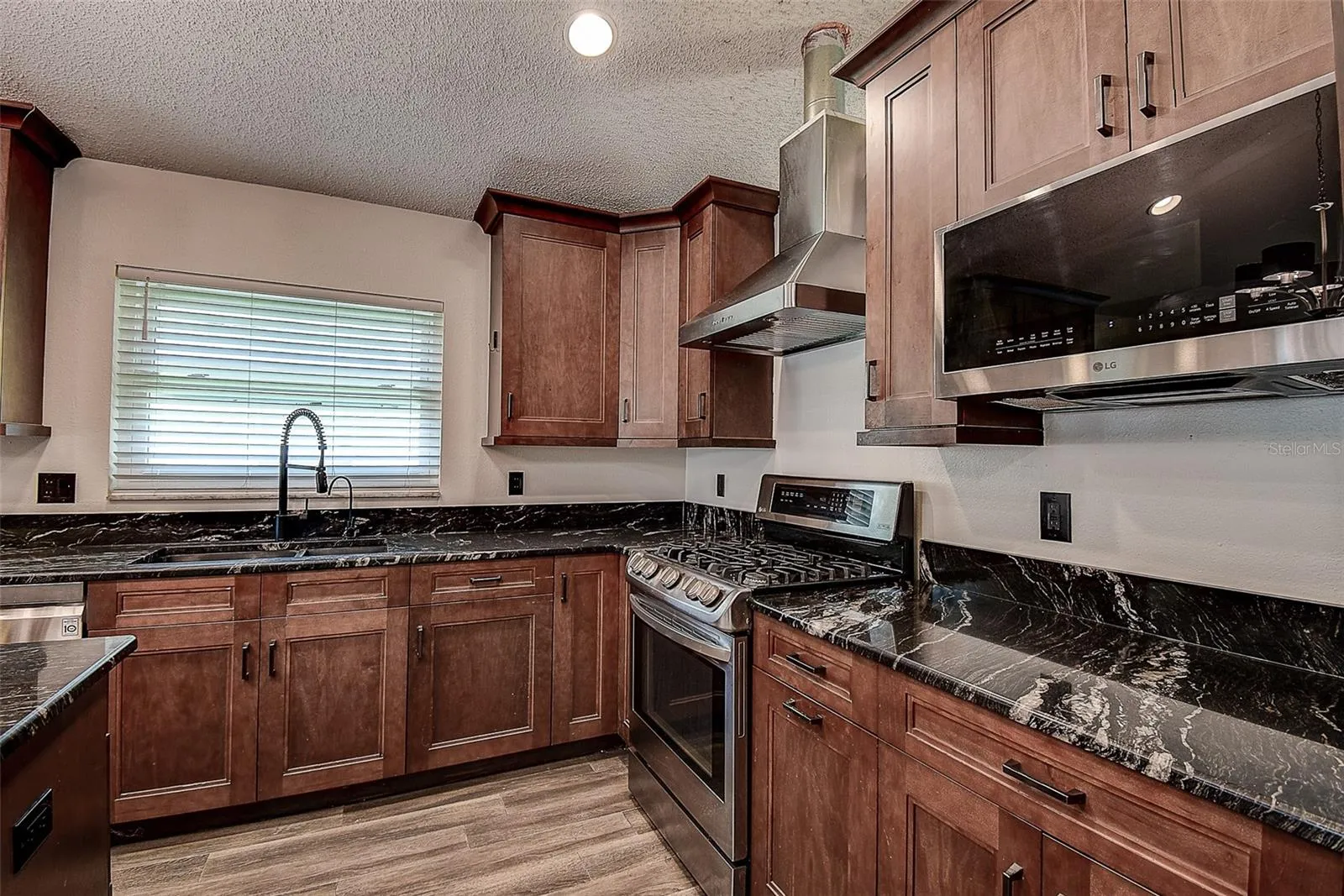 Large Kitchen with all wood soft close cabinetry and built-in microwave