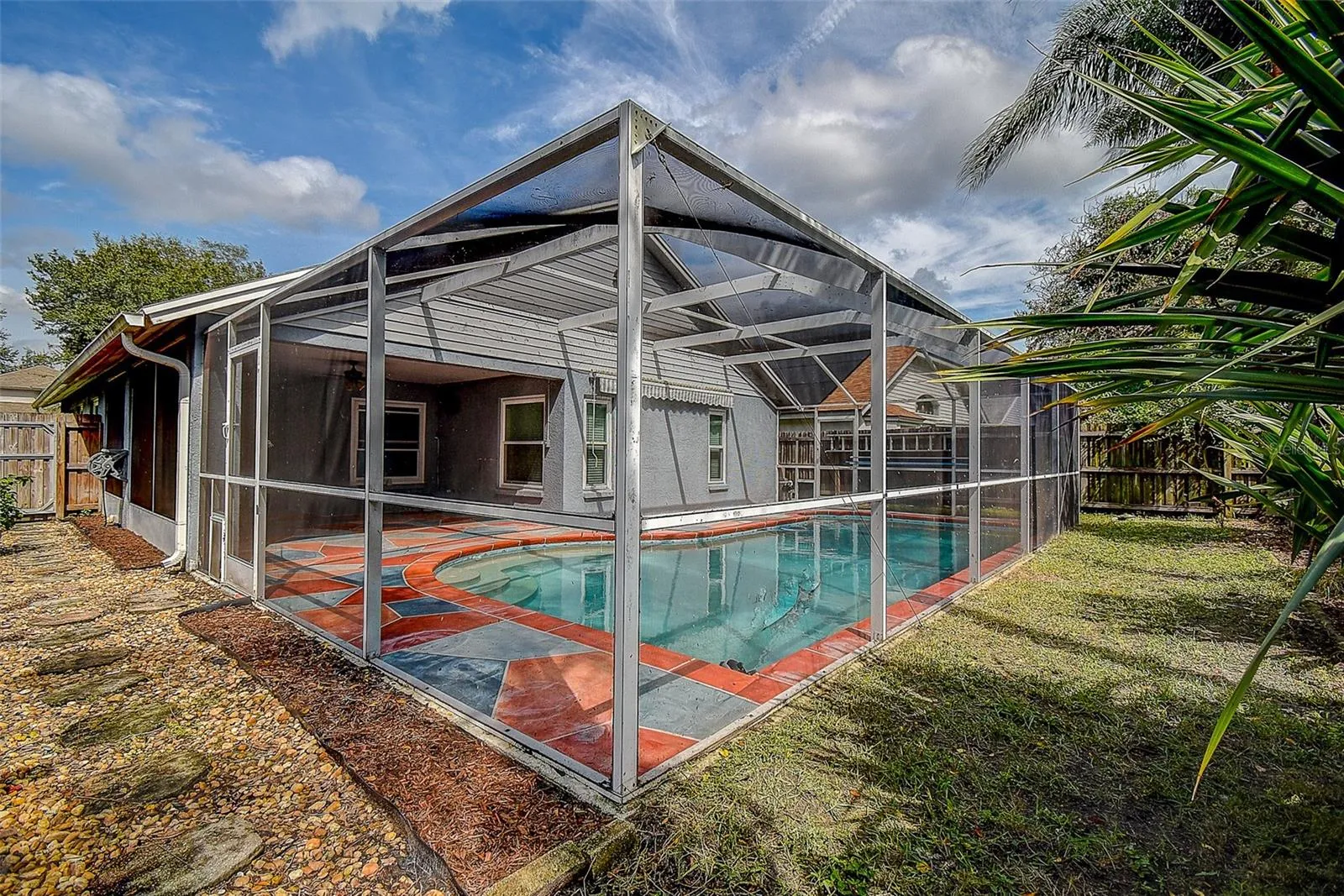 View of pool and screened porch