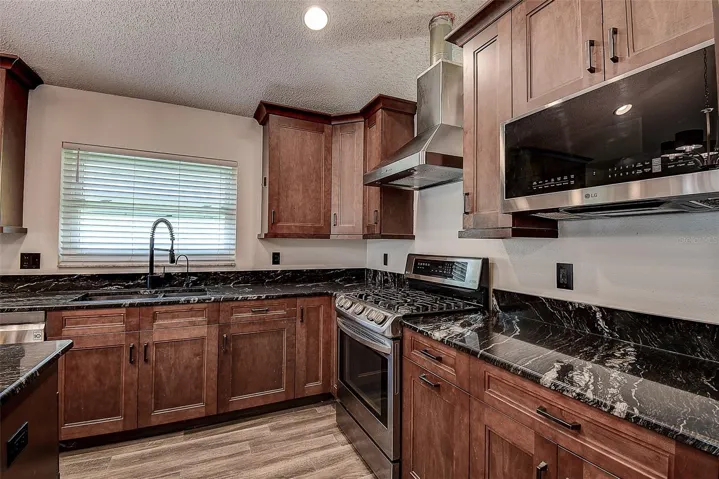 Large Kitchen with all wood soft close cabinetry and built-in microwave