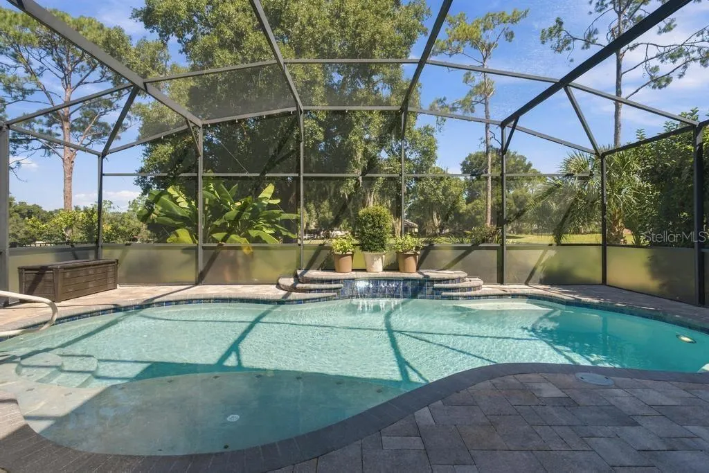 Love this waterfall in this custom pool