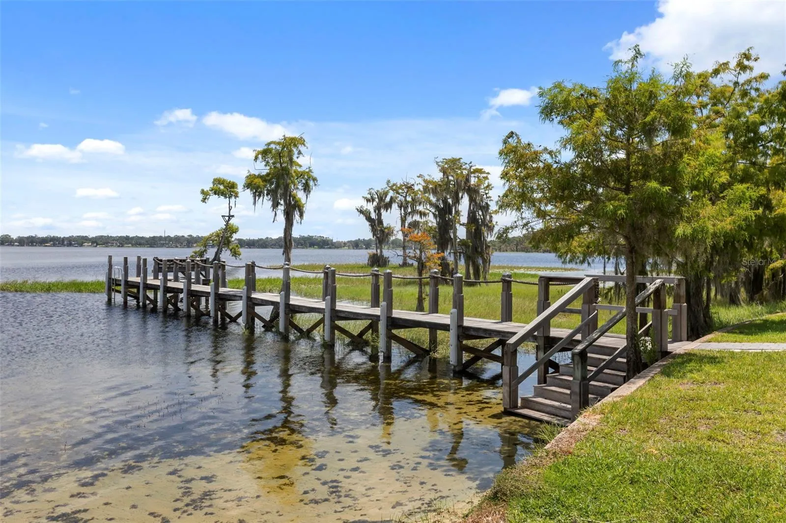 A private dock and boatlift provide access to Lake Sheen and the entire Butler Chain, while a gated community boat ramp is approximately 300 feet away.