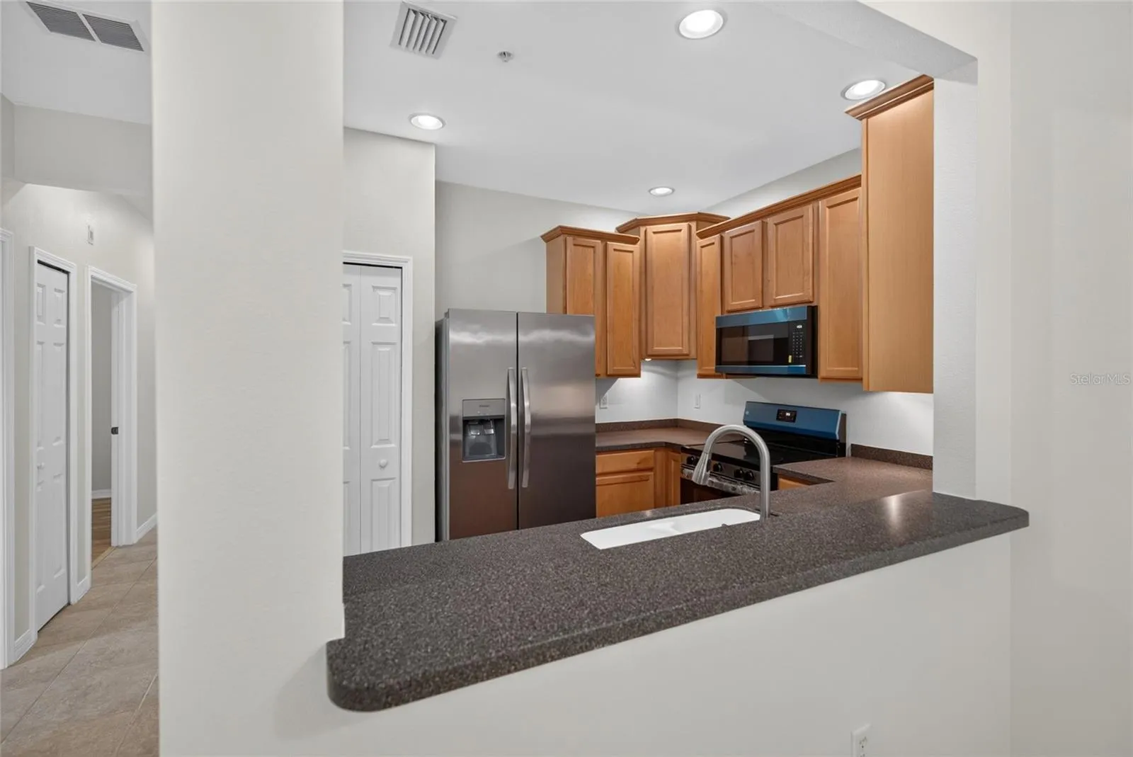 Kitchen with breakfast bar pass-through