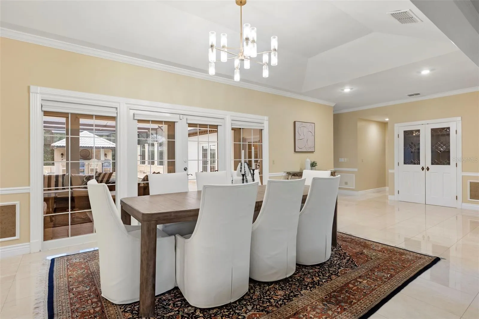 Formal Dining Room with French Doors leading to Courtyard