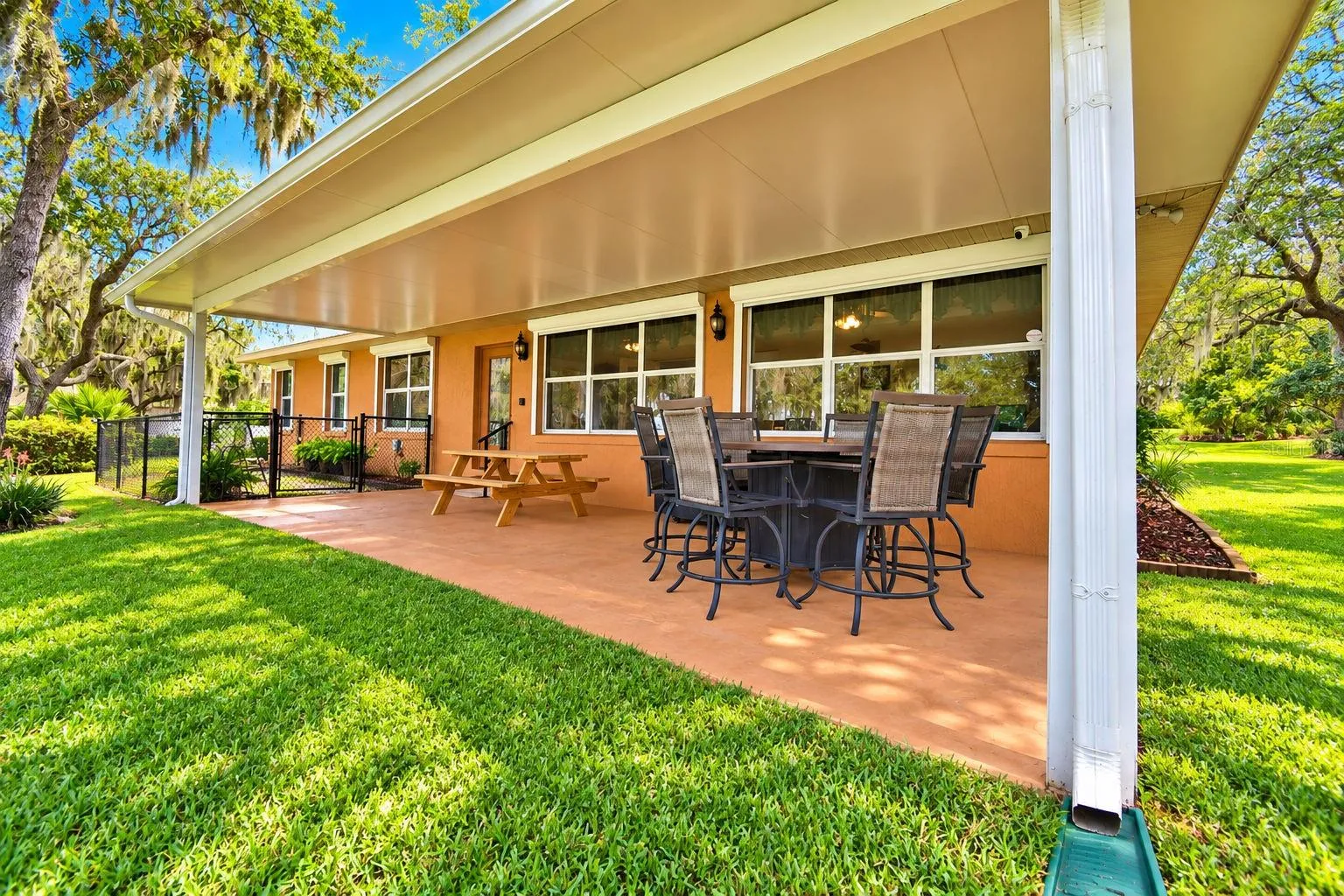 Open back patio with fenced dog run