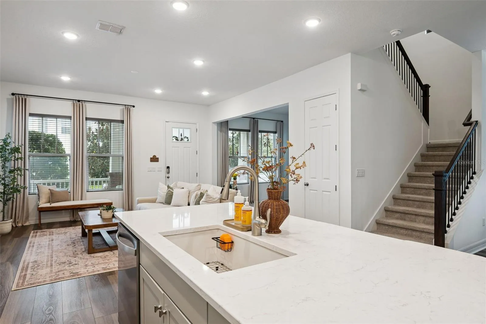 Kitchen Overlooks Living and Dining Rooms