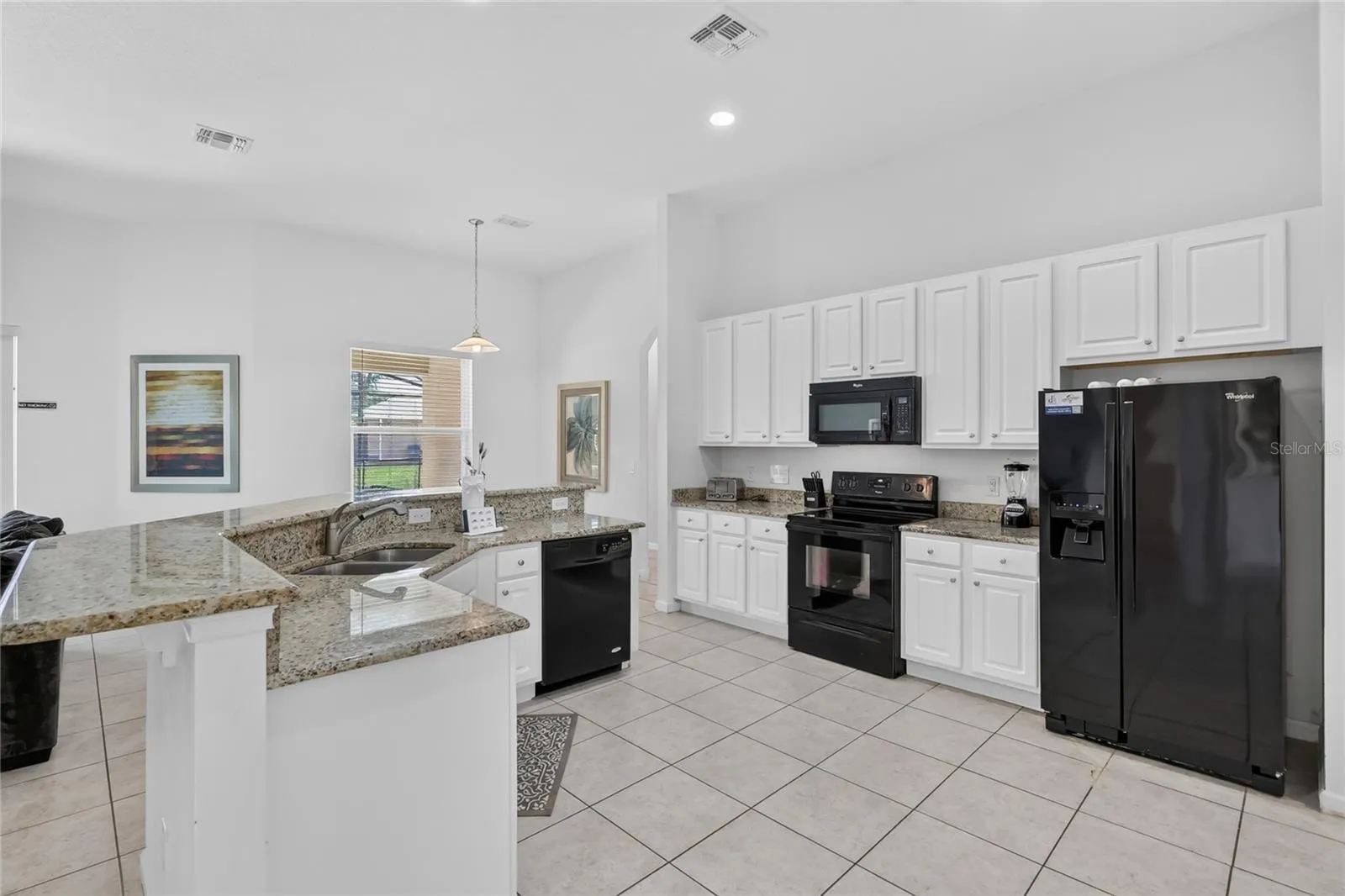 Large open concept kitchen with granite countertops