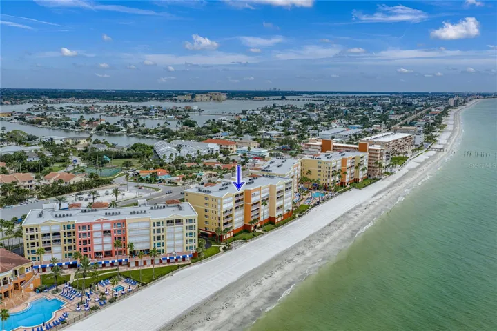 Tides Beach Club: Top Floor Unit with Double Private Balcony Custom Designed Kitchen and Baths plus Private Parking.