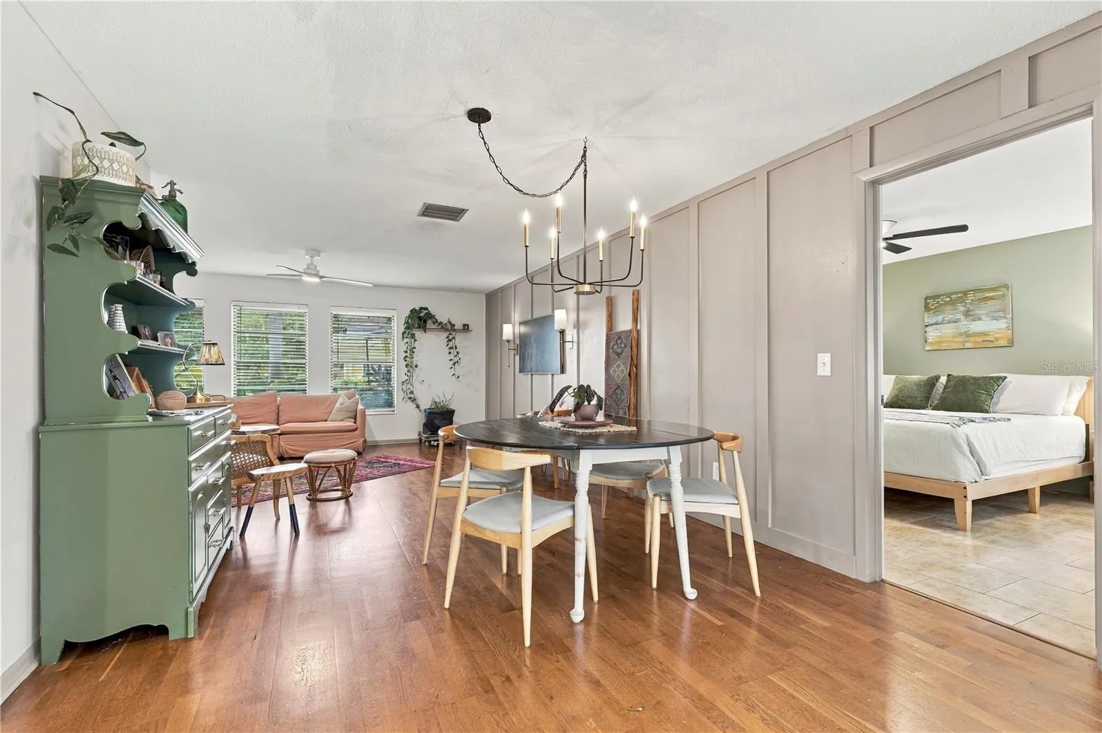 Dining room from sun room, entry to primary bedroom
