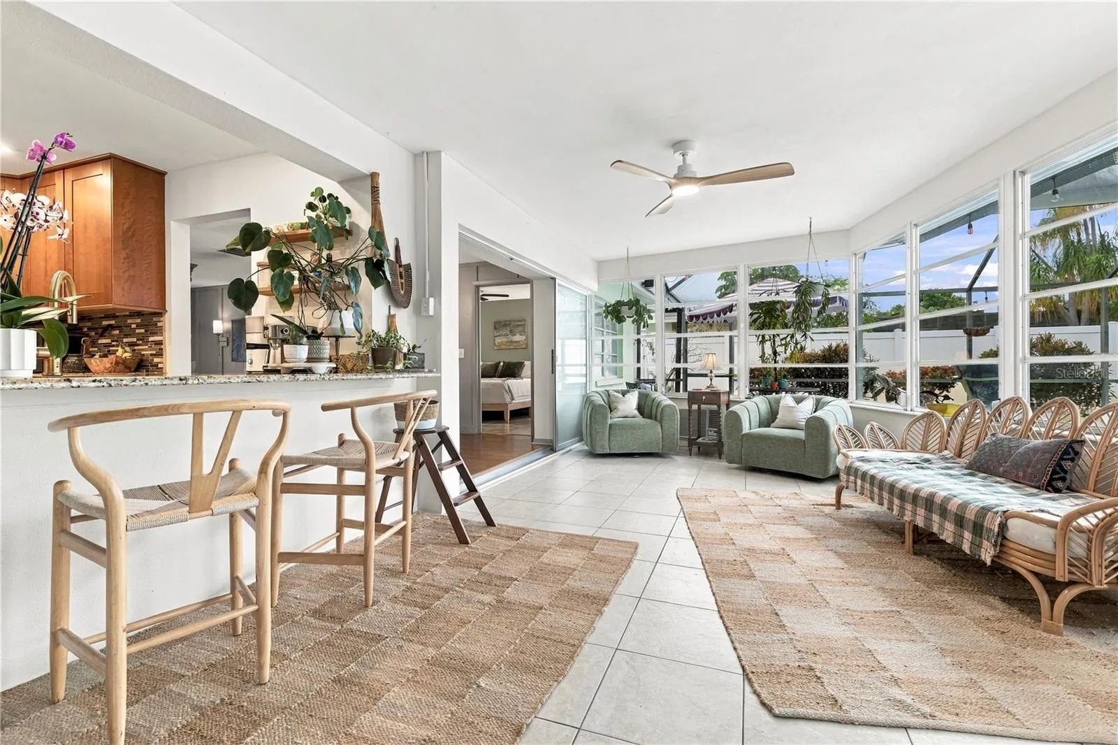 Sun room entry looking into dining and kitchen from family room