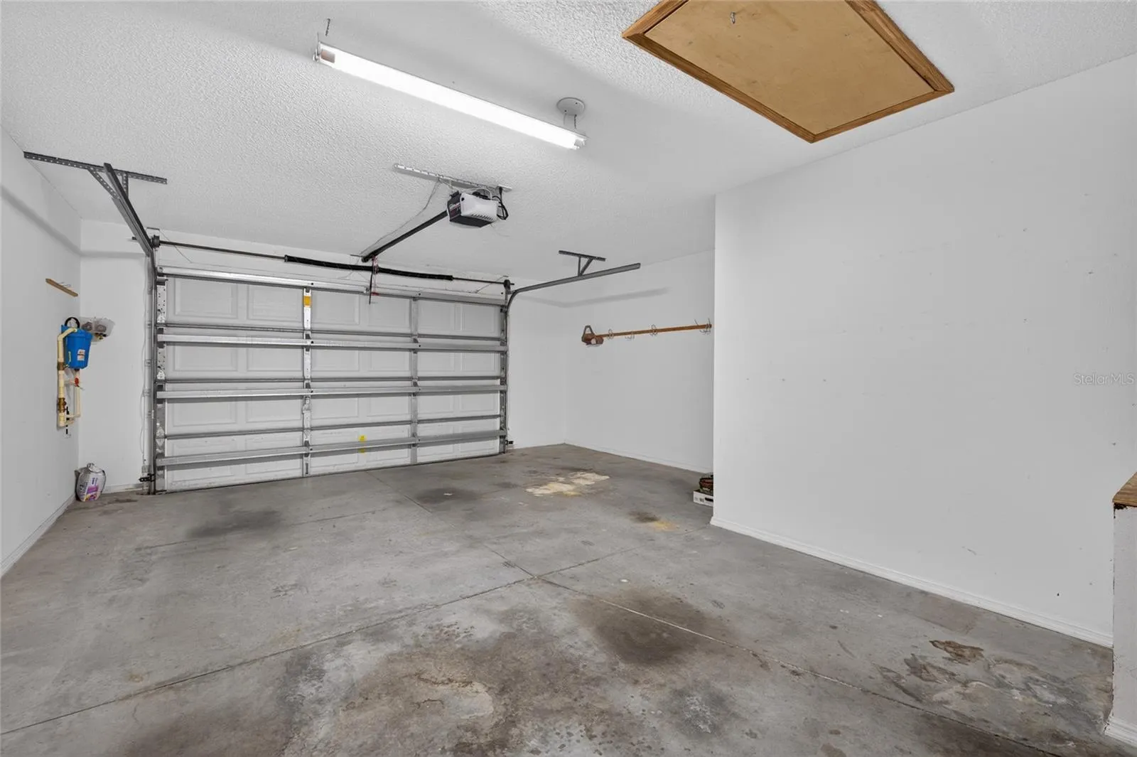 1.5 CAR GARAGE - PULL DOWN ATTIC STAIRS overhead (front R) and WHOLE-HOUSE WATER FILTRATION equipment on the L wall (west side of home).