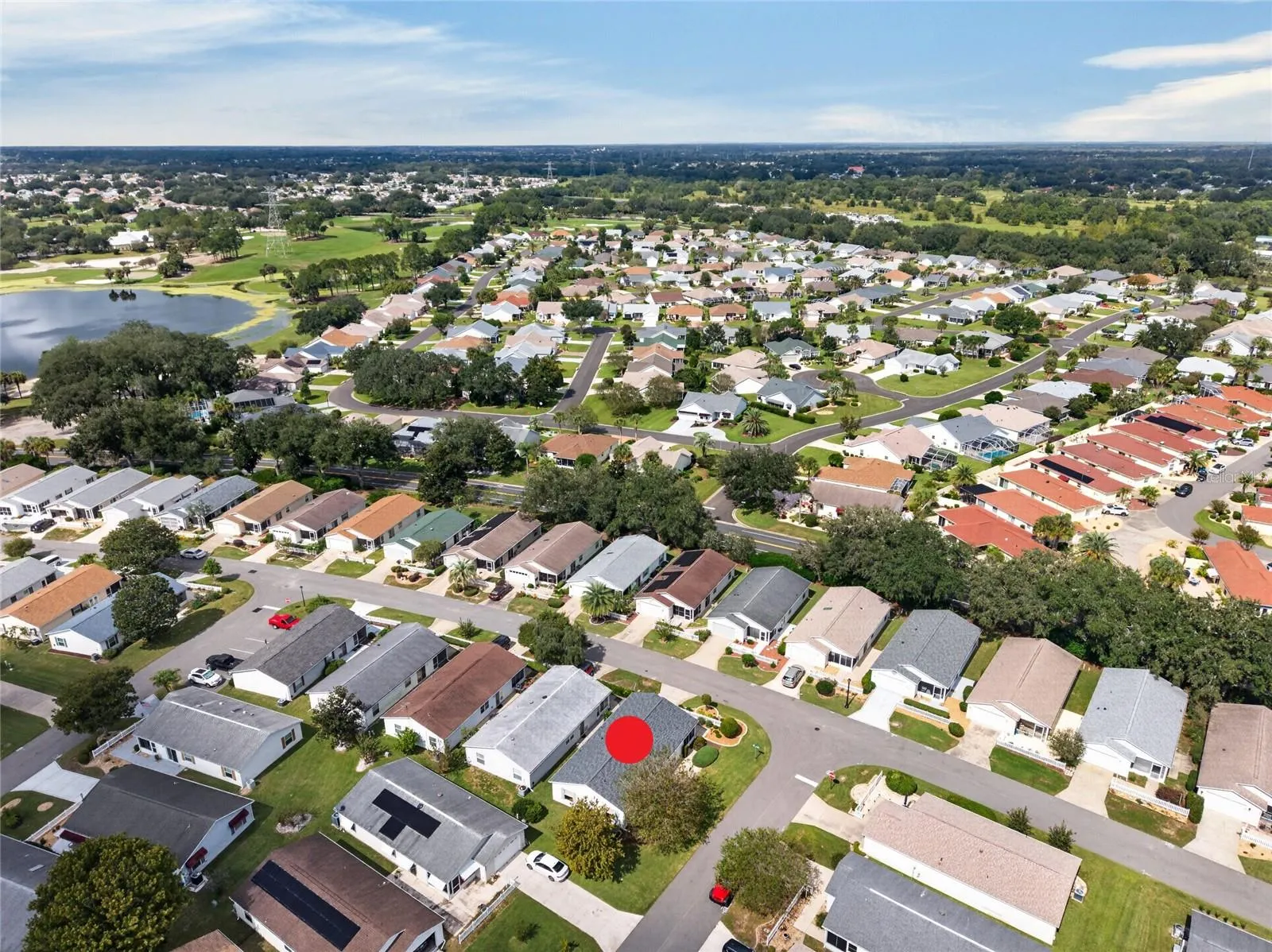 AERIAL – Looking Northwest – Tree-lined streets lead toward the lake and fairways of the El Diablo and El Santiago Executive Golf Courses, with El Santiago Recreation Center's pool and tennis courts close to home.