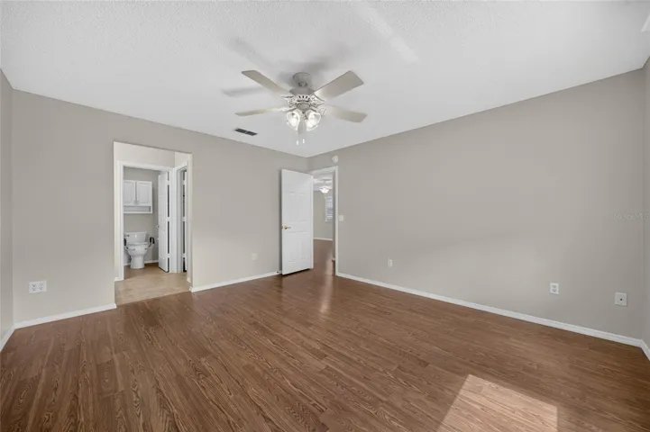PRIMARY BEDROOM - Broad wall space and a spacious open floor area offer room for king-size bedding and furnishings.