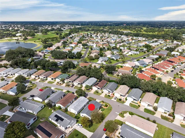 AERIAL – Looking Northwest – Tree-lined streets lead toward the lake and fairways of the El Diablo and El Santiago Executive Golf Courses, with El Santiago Recreation Center's pool and tennis courts close to home.
