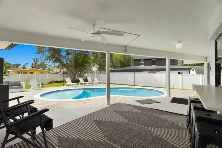 Fabulous covered back patio, pavered pool deck and new pool