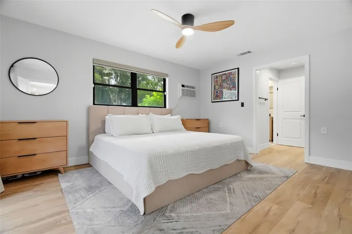 Primary Bedroom with Electronic Blinds &amp; Extra window AC for those who like it extra cold at night!