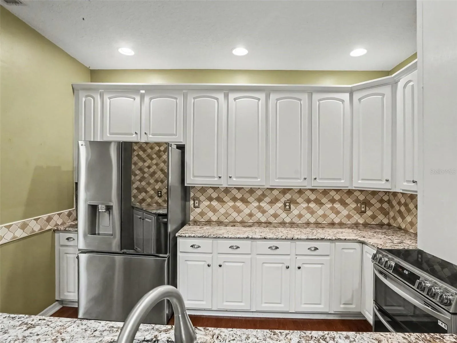 Kitchen with a new refrigerator purchased in October 2025