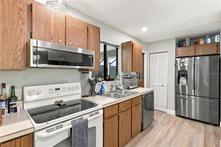 Kitchen, Closet Pantry, Stainless Steel Refrigerator, Dishwasher & Microwave.