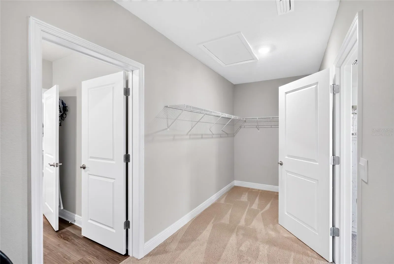 Primary closet virtually staged