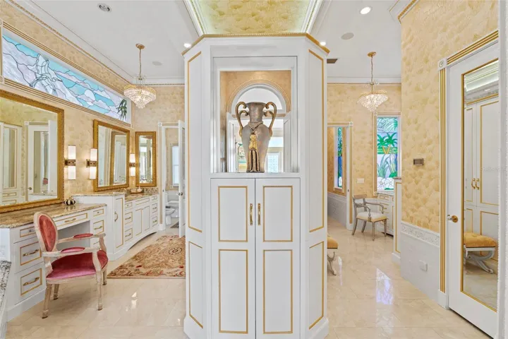 Primary Ensuite Bath has separate Vanities, Water Closets and Wardrobes.