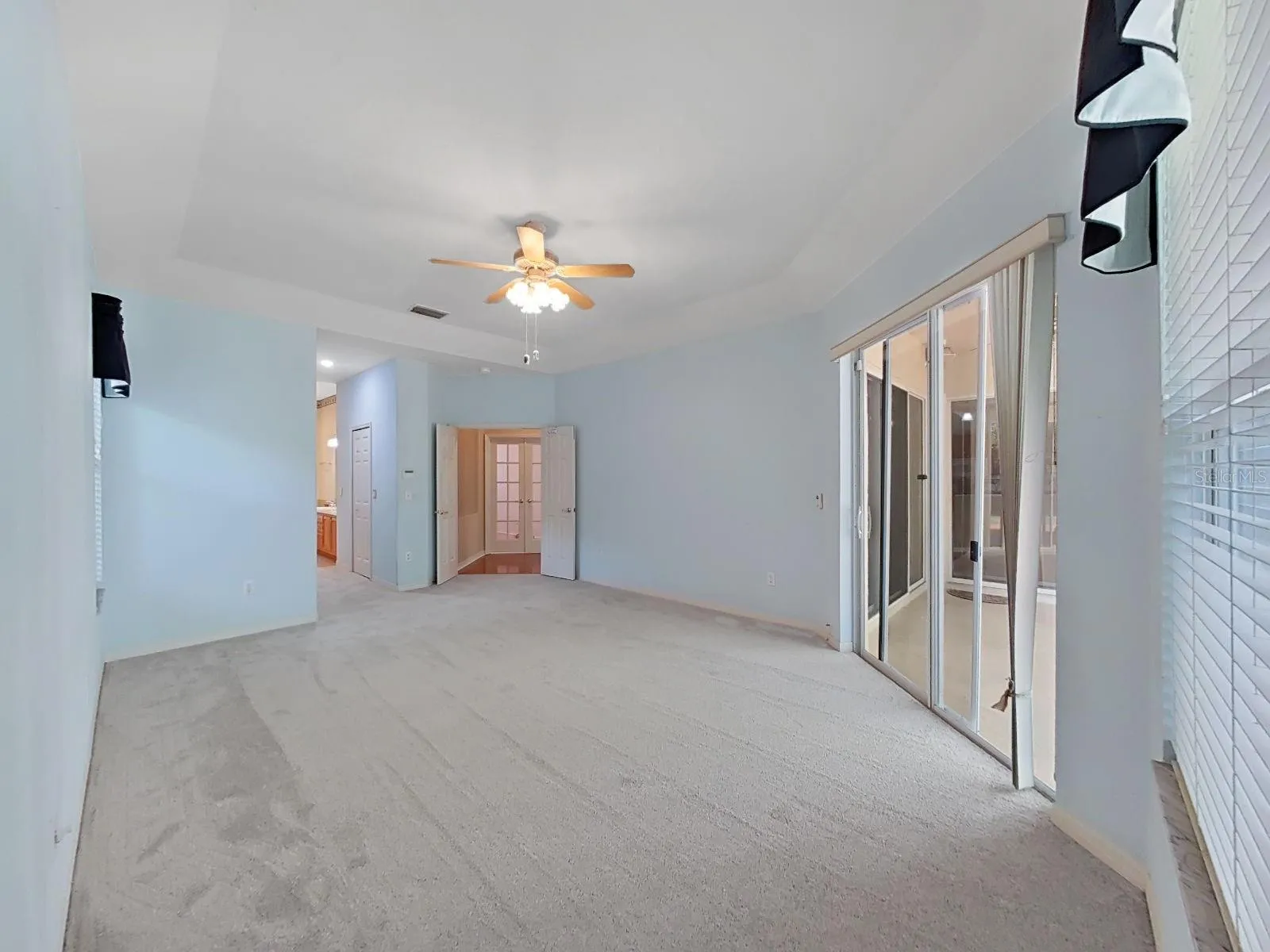 Primary Bedroom ~ Doors Open to Lanai