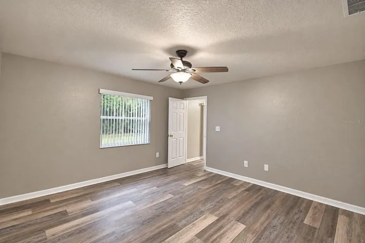 another view of the primary bedroom