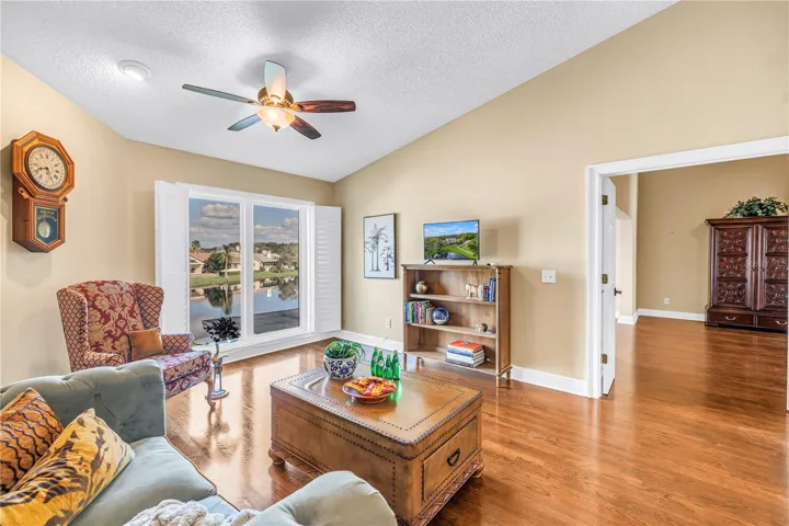 This unique upstairs bonus living space in Caya Costa features vaulted ceilings and premium hardwood flooring. The room offers expansive views of the lake through floor-to-ceiling hurricane-rated windows.