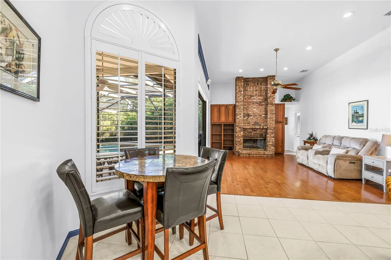 Breakfast or causal dining area adjacent to the kitchen and great room with views of the pool.