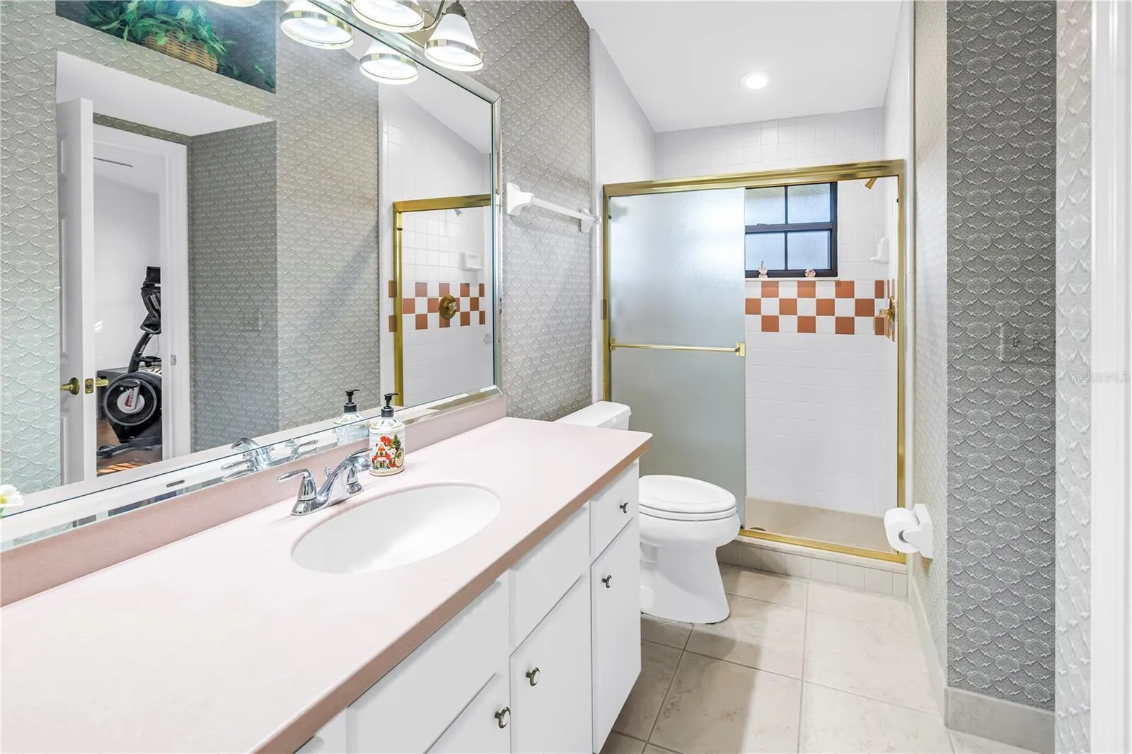 Bath 3 has a walk-in shower and access from the pool and Bedroom 3