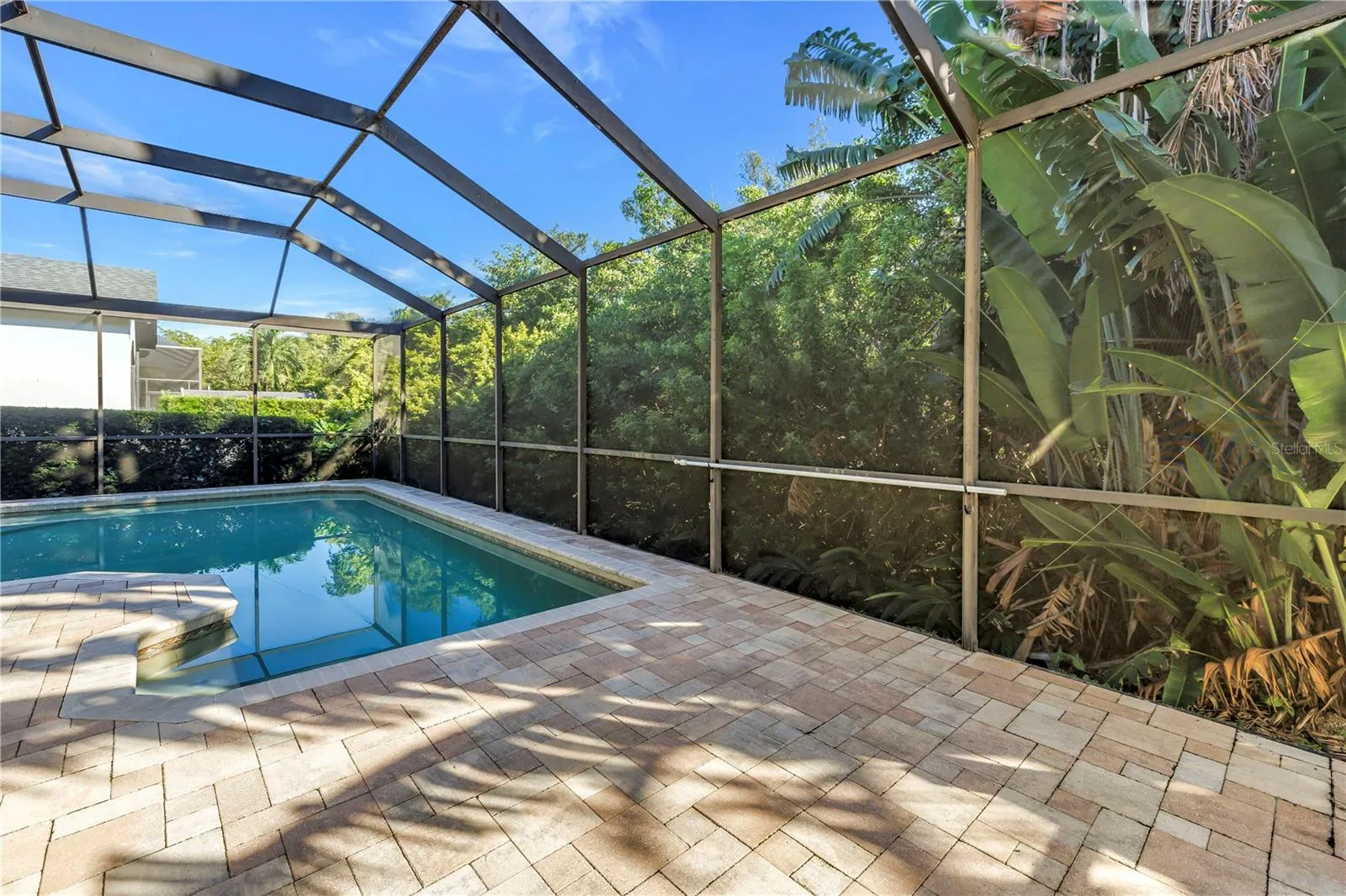 This stunning pool area features multiple access points, including convenient in-pool seating for ultimate relaxation. The surrounding preserve provides a natural, scenic backdrop while offering excellent protection from high winds and storms.