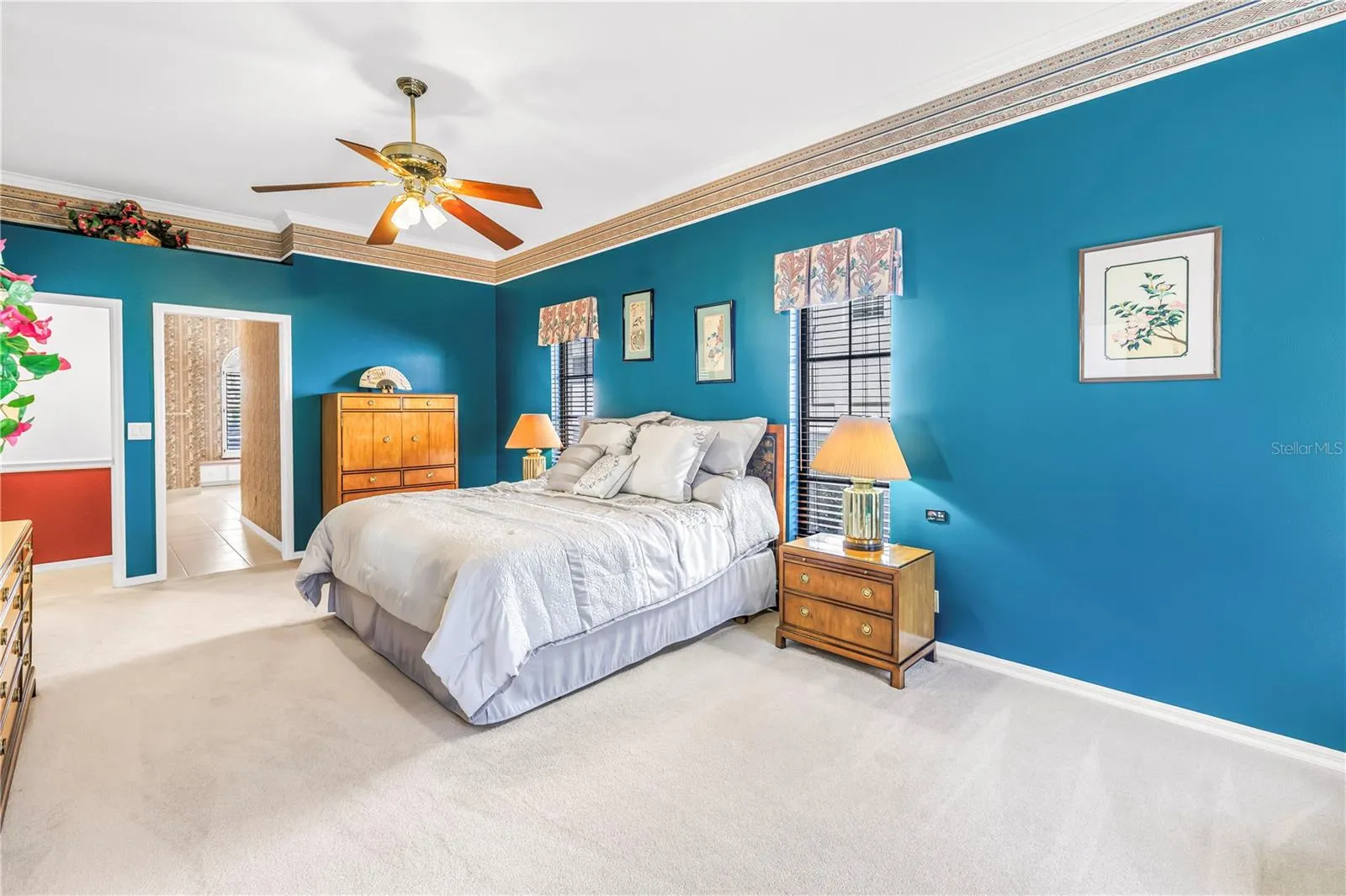 Primary Bedroom with doors to en suite bath and living room.  10 Foot Ceilings, windows and (2) 8-Foot sliders to the pool deck.  SEE VIRTUAL RENDERING IN PHOTO 61