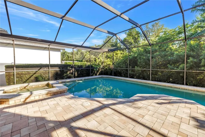 This beautifully designed paver pool deck is engineered to stay cool during the summer and warm in the winter, providing year-round comfort for outdoor relaxation.