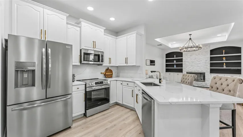 Gorgeous Kitchen with Quartz Counter tops  and backsplash and New Stainless Steel Appliances