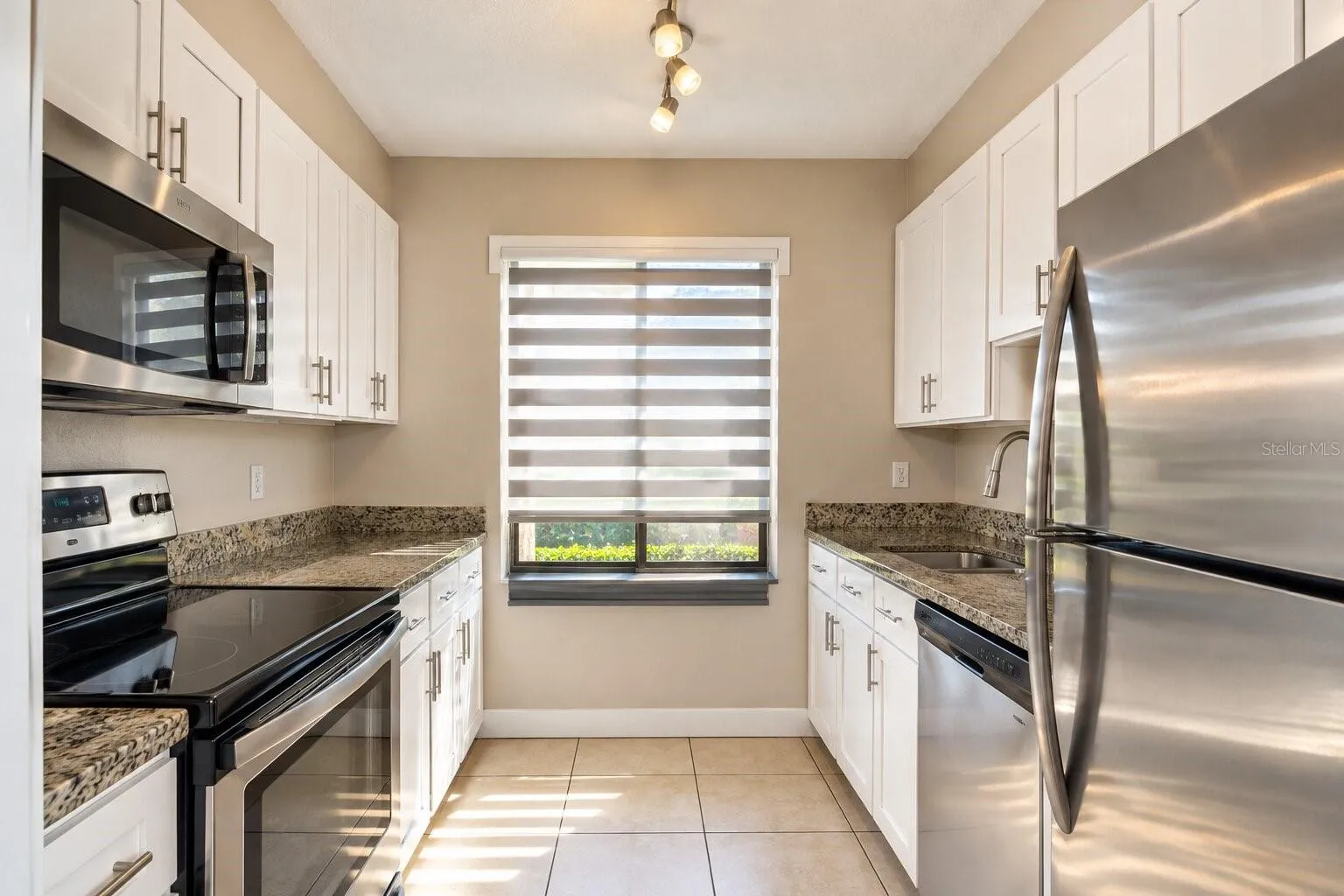Kitchen with granite countertops and stainless steel appliances