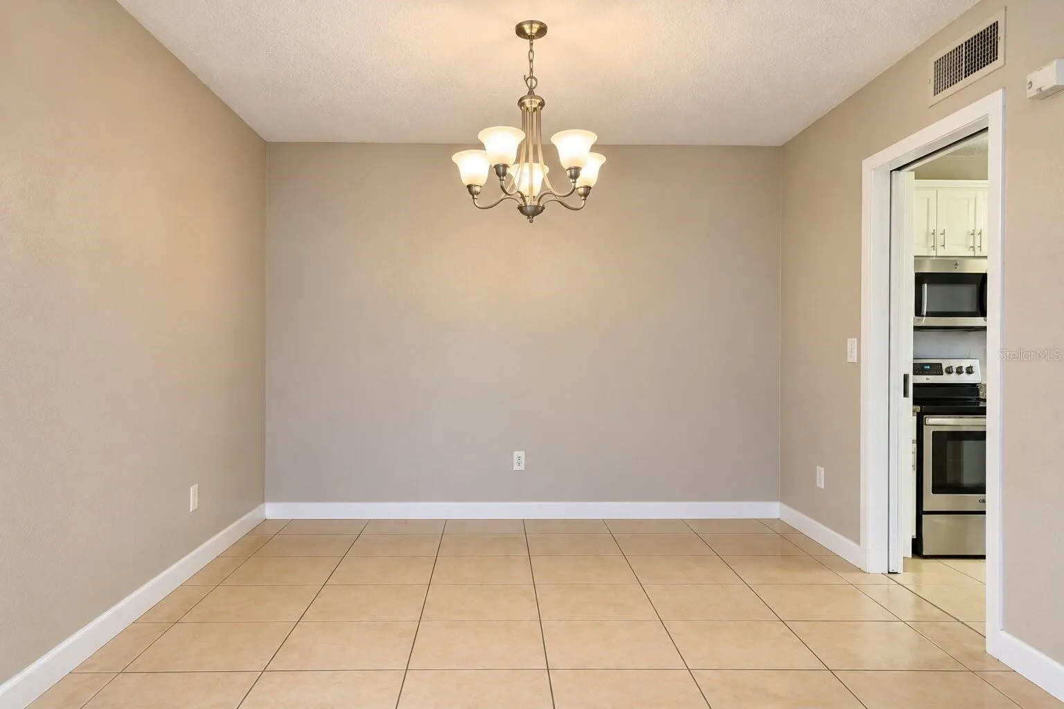 Dining area with chandelier lighting