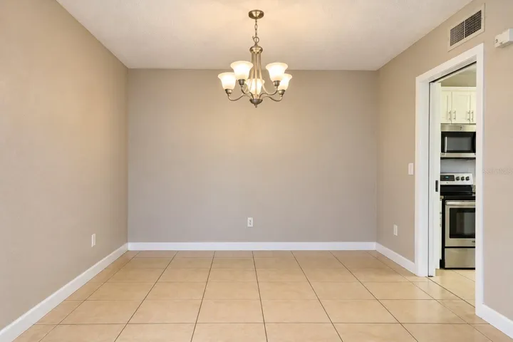Dining area with chandelier lighting