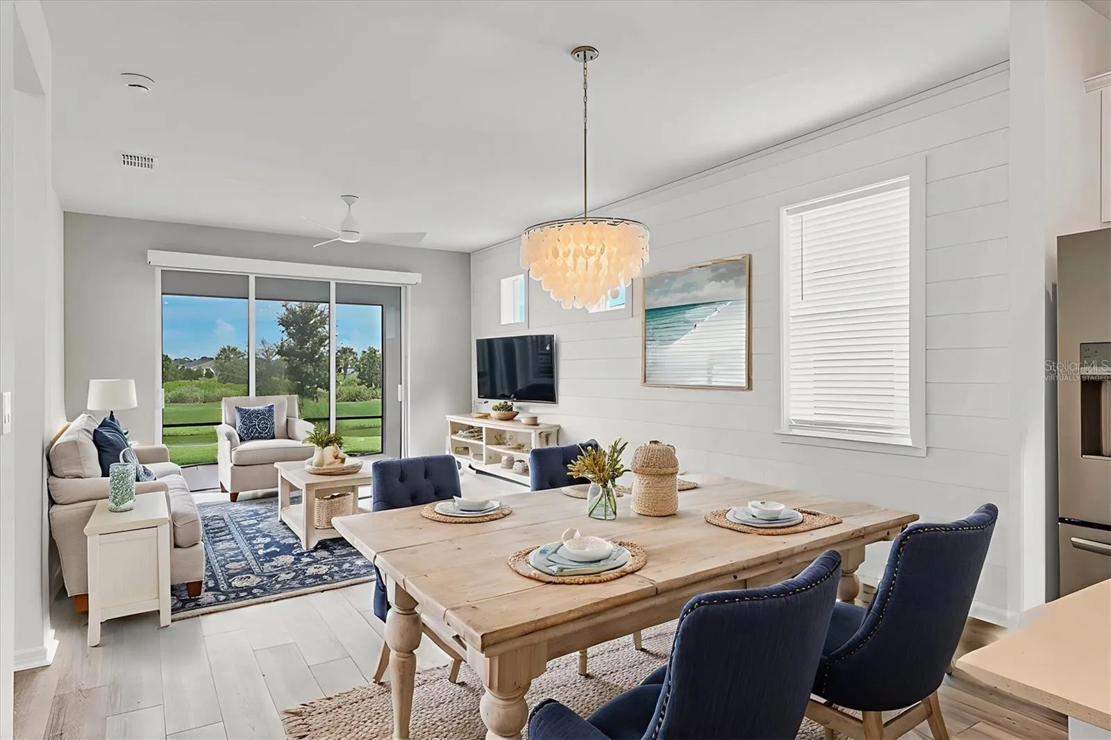 Virtually staged living and dining rooms.