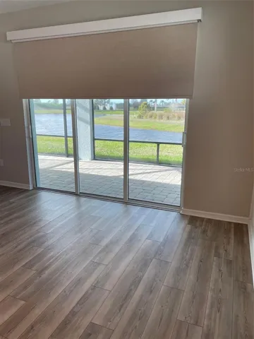 Remote control custom blind at patio door.