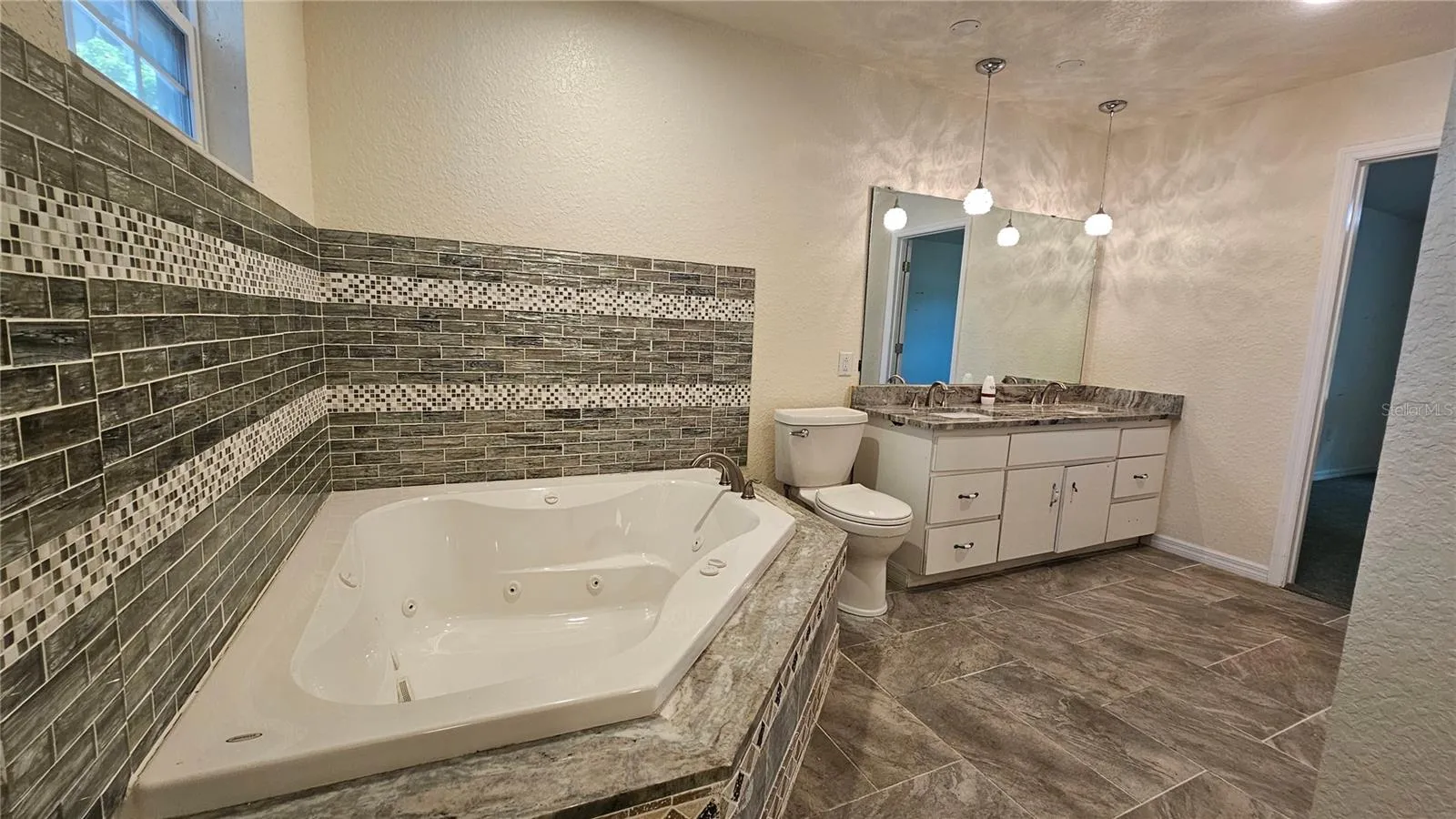 Primary bathroom jacuzzi tub