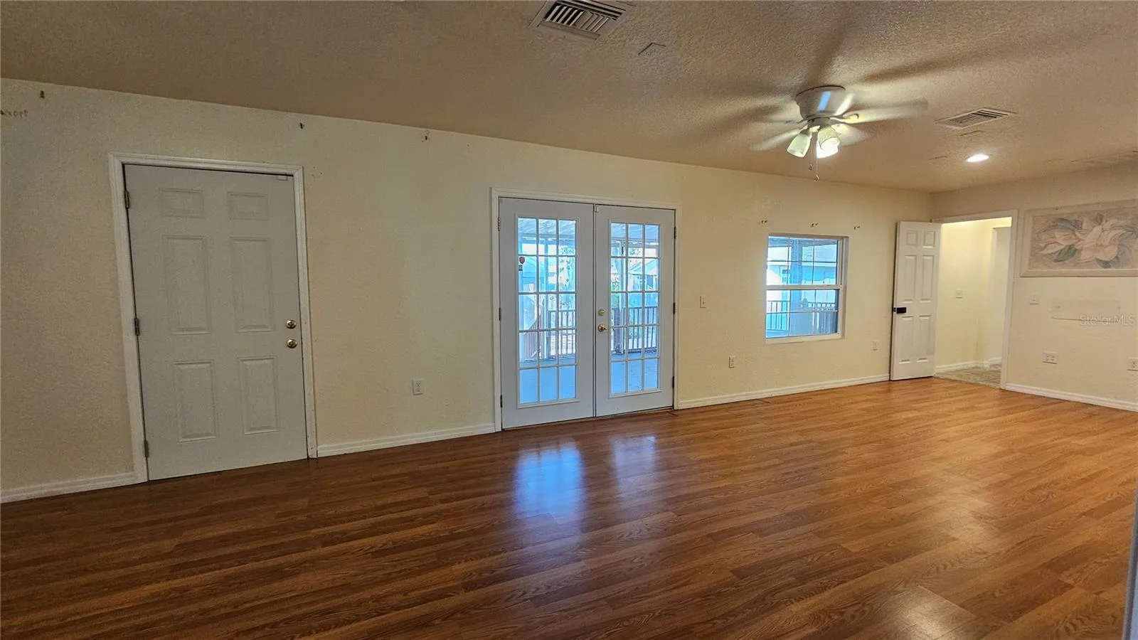 Looking at back porch through family room french double doors
