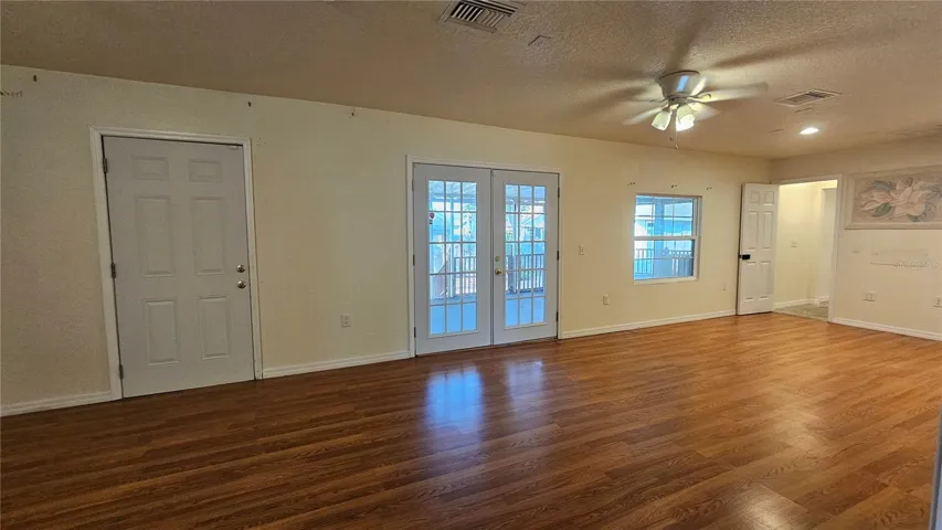 Looking at back porch through family room french double doors