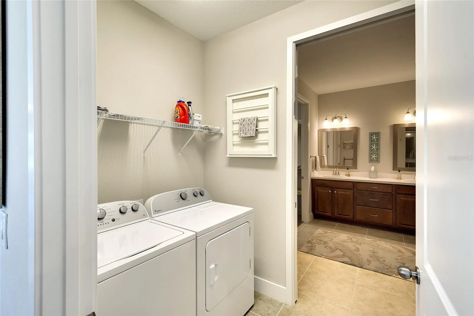 Pass through laundry room, conveniently located to kitchen and owner's bath