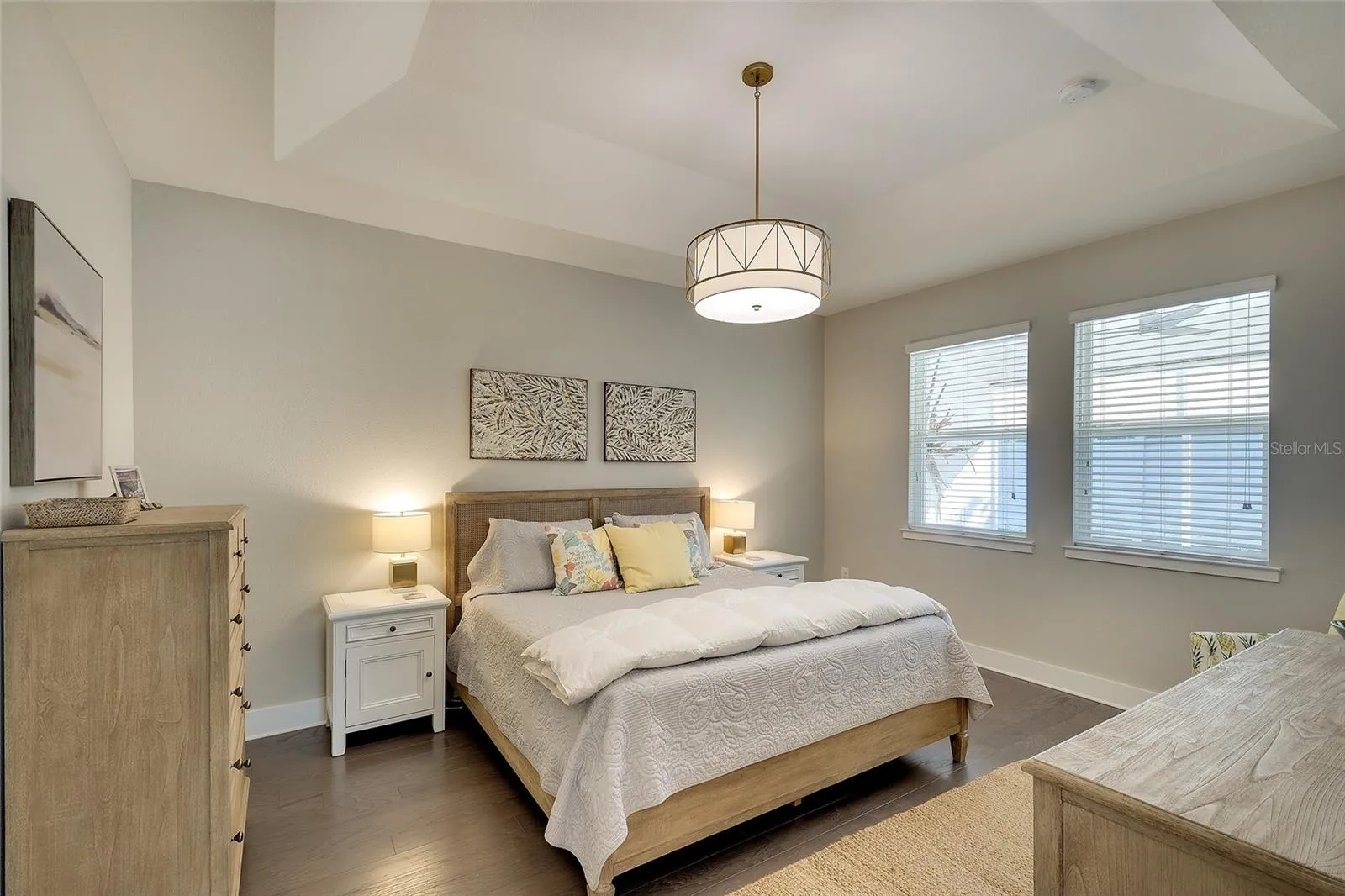 Owner's retreat with comfort color quality paint, decorative lighting, designer flooring