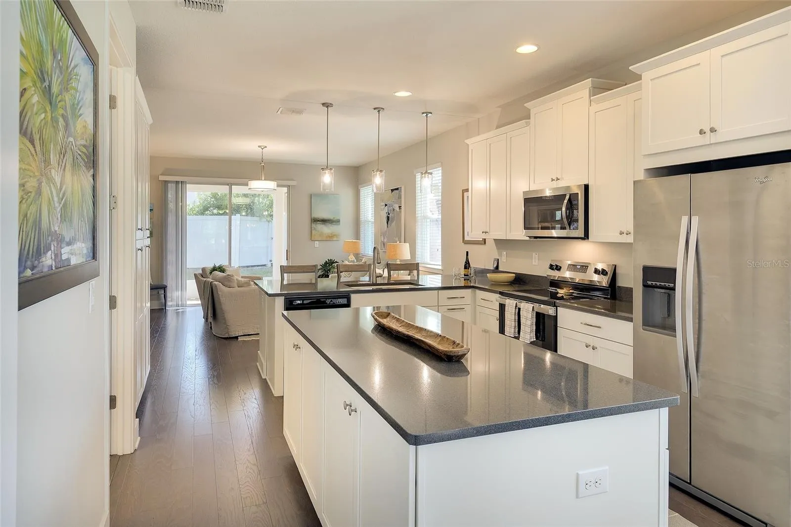 Great storage with 42" uppers, designer cabinetry, dbl pantry and island cabinets!